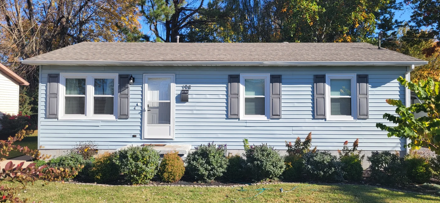 A Petersburg, IN home features a comfortable enclosed patio designed for additional living space.