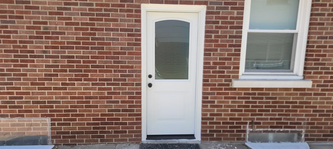 An enclosed porch creates a comfortable place for Petersburg, IN homeowners to relax and entertain.