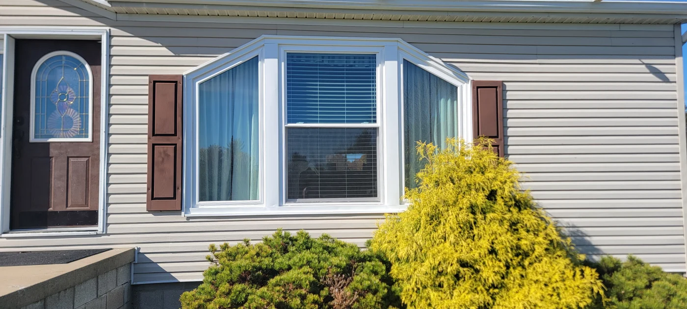 A bright enclosed patio provides additional usable living space for a Petersburg, IN home.